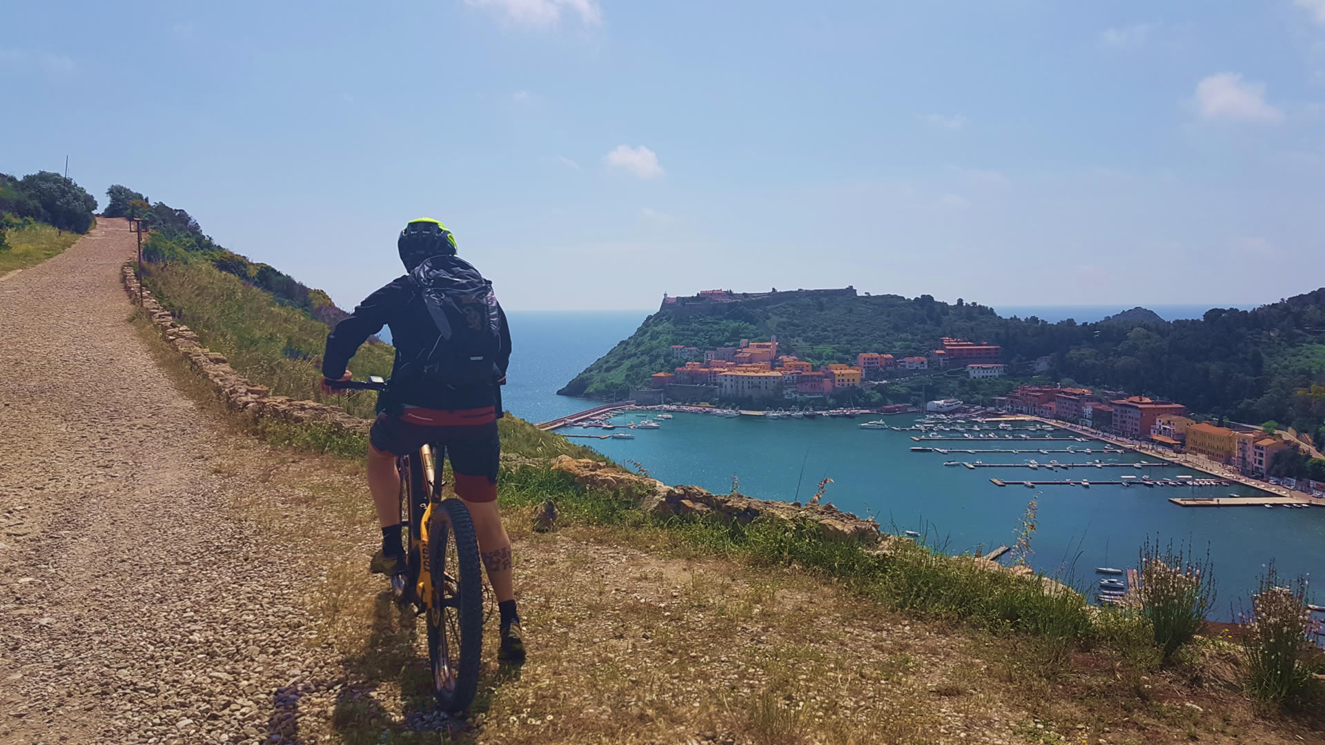 Argentario by bike - view of the argentario peninsula from above riding a bicycle